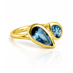 London Blue Topaz Toi et Moi Yellow Gold Ring on a white background