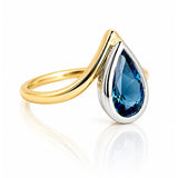 London Blue Topaz Ring in Yellow & White Gold on a white background