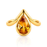Pear Cut Bezel Set Citrine Ring in Yellow Gold on a white background