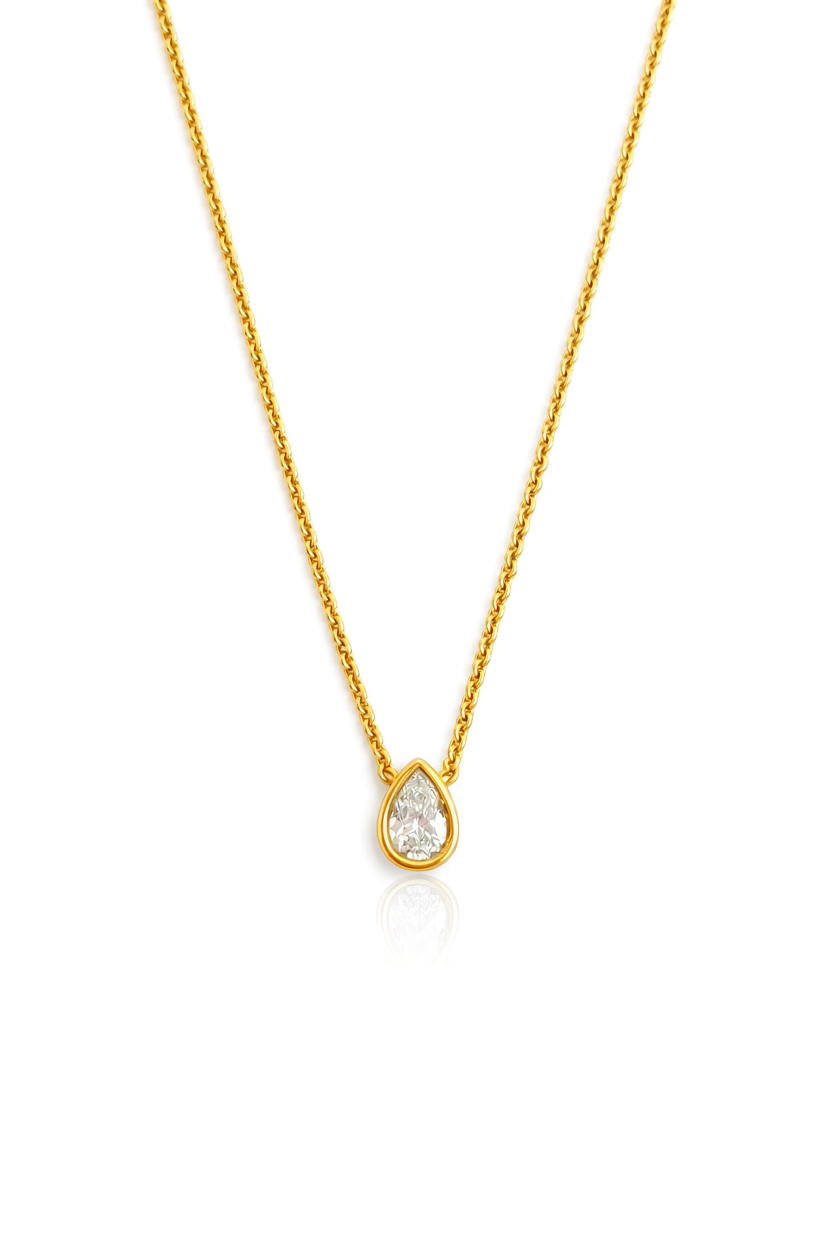 Gold necklace with a teardrop-shaped diamond pendant on a white background at LeGassick.