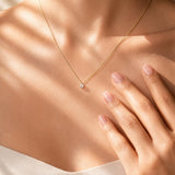 Diamond Solitaire Pendant on a white gold chain on a lady's torso