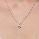 Lady wearing a Rhodolite Garnet & Diamond Pendant set in 18ct White Gold