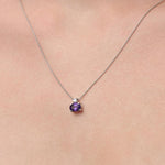 Lady wearing a Amethyst & Diamond Pendant set in 18ct White Gold