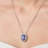 Necklace with a tanzanite pendant on a person wearing a white top