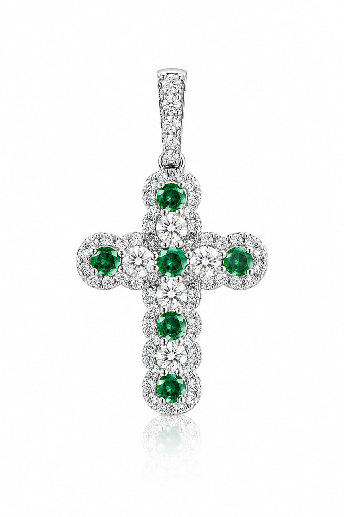 A white gold cross pendant featuring a central cluster of round green emeralds surrounded by pavé-set clear diamonds, shown on a white background with a soft reflection.