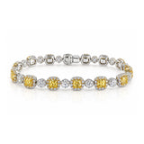 Fancy Yellow Cushion Cut Diamond Halo Bracelet in White & Yellow Gold
