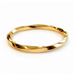 Fancy Twisted Italian Hinged Bangle In 14 Carat Yellow Gold from LeGassick Jewellery, Gold Coast, Australia.