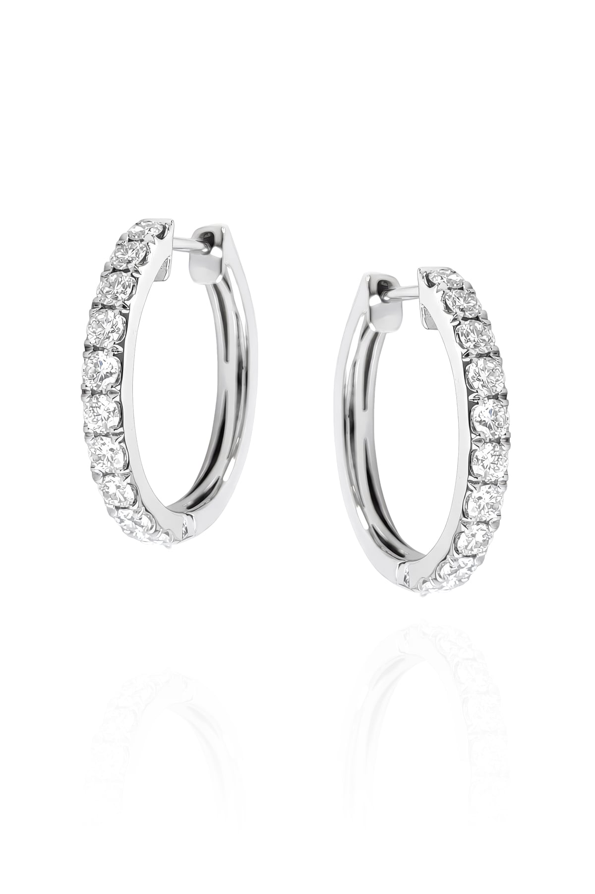 Pair of white gold hoop earrings with clear diamonds on a white background