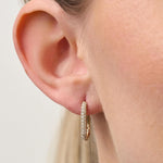 Lady wearing Pave Rectangle Huggie Earrings In 18ct Yellow Gold