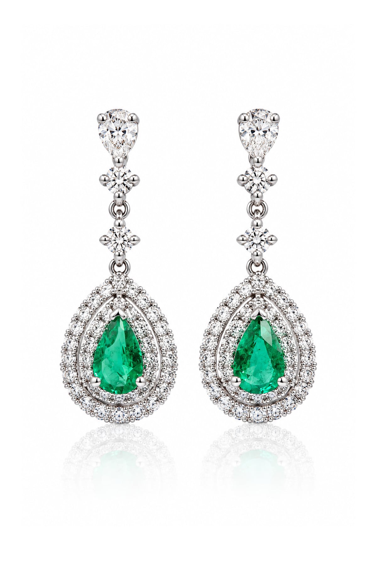 Pair of 18ct white gold Colombian emerald and diamond drop earrings featuring pear-shaped green emeralds surrounded by double halos of round brilliant-cut diamonds.