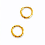 Pair of gold hoop earrings on a white background