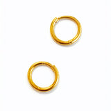 Pair of gold hoop earrings on a white background
