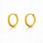 Pair of gold hoop earrings on a white background