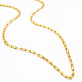 Gold chain necklace on a white background