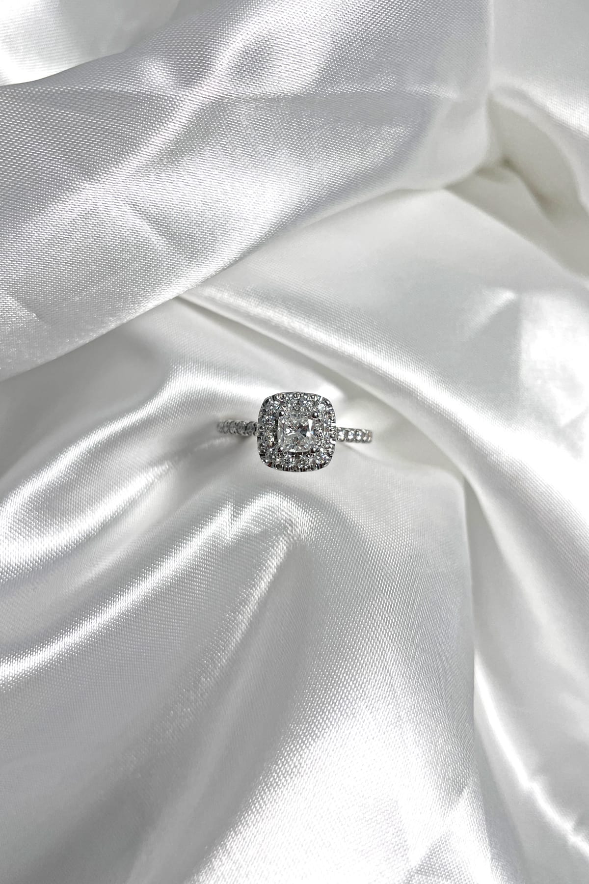18 carat white gold 0.50ct cushion cut diamond halo ring available at LeGassick Diamonds and Jewellery Gold Coast, Australia