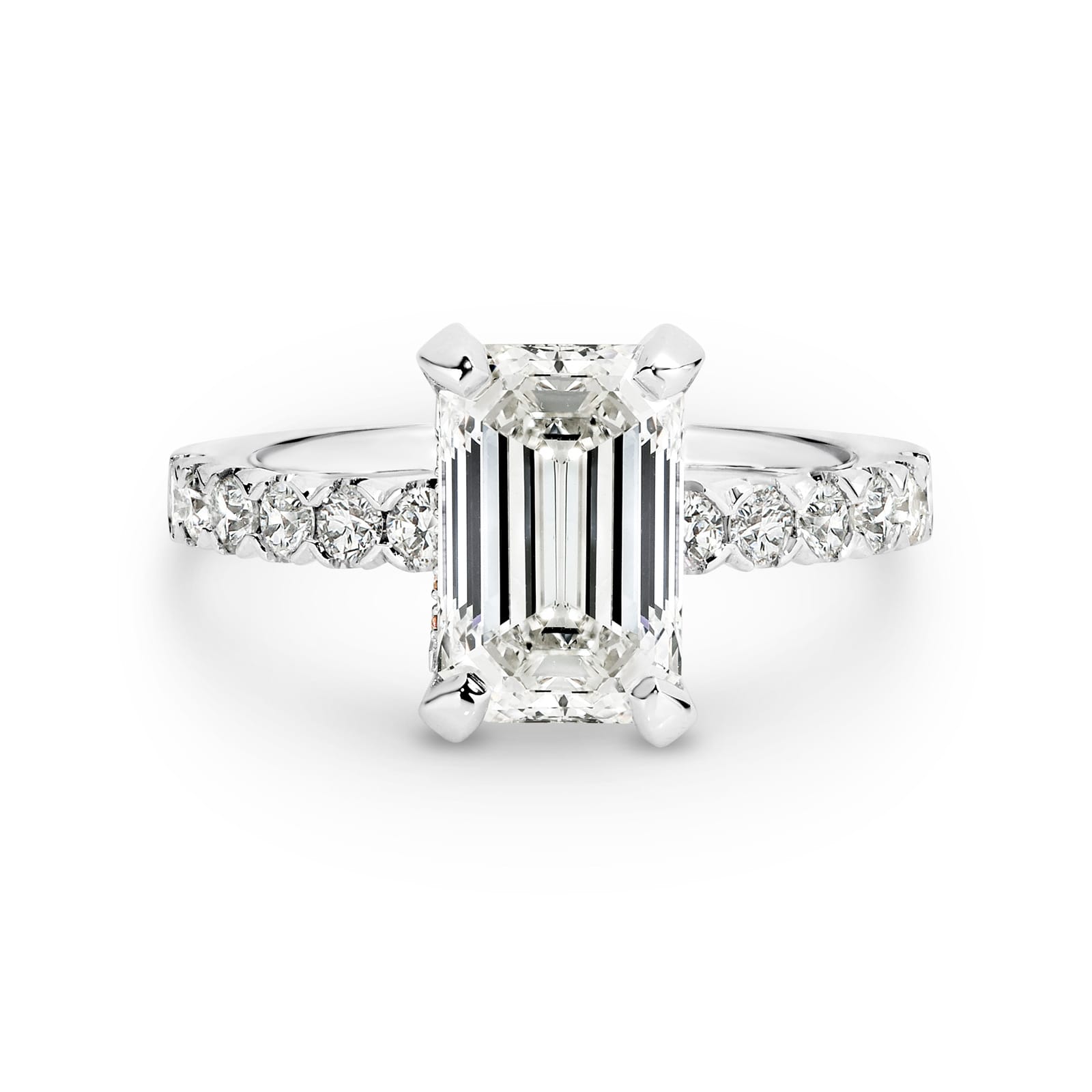 Athena features a 3.02 carat Emerald-cut solitaire diamond, handcrafted in platinum and supported by 12 round brilliant cut diamonds in the band totalling 0.48ct. Athena is softened by a fine ribbon of rose gold around the white diamond, delicately set with rare Argyle pink diamonds. She was designed and handcrafted by LeGassick's Master Jewellers, Gold Coast, Australia.