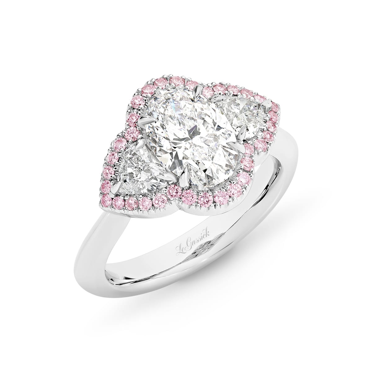 Briannah has a 2-carat oval centre diamond with a pair of heart-shaped diamonds and pink diamonds created by LeGassick Diamonds and Jewellery Gold Coast, Australia