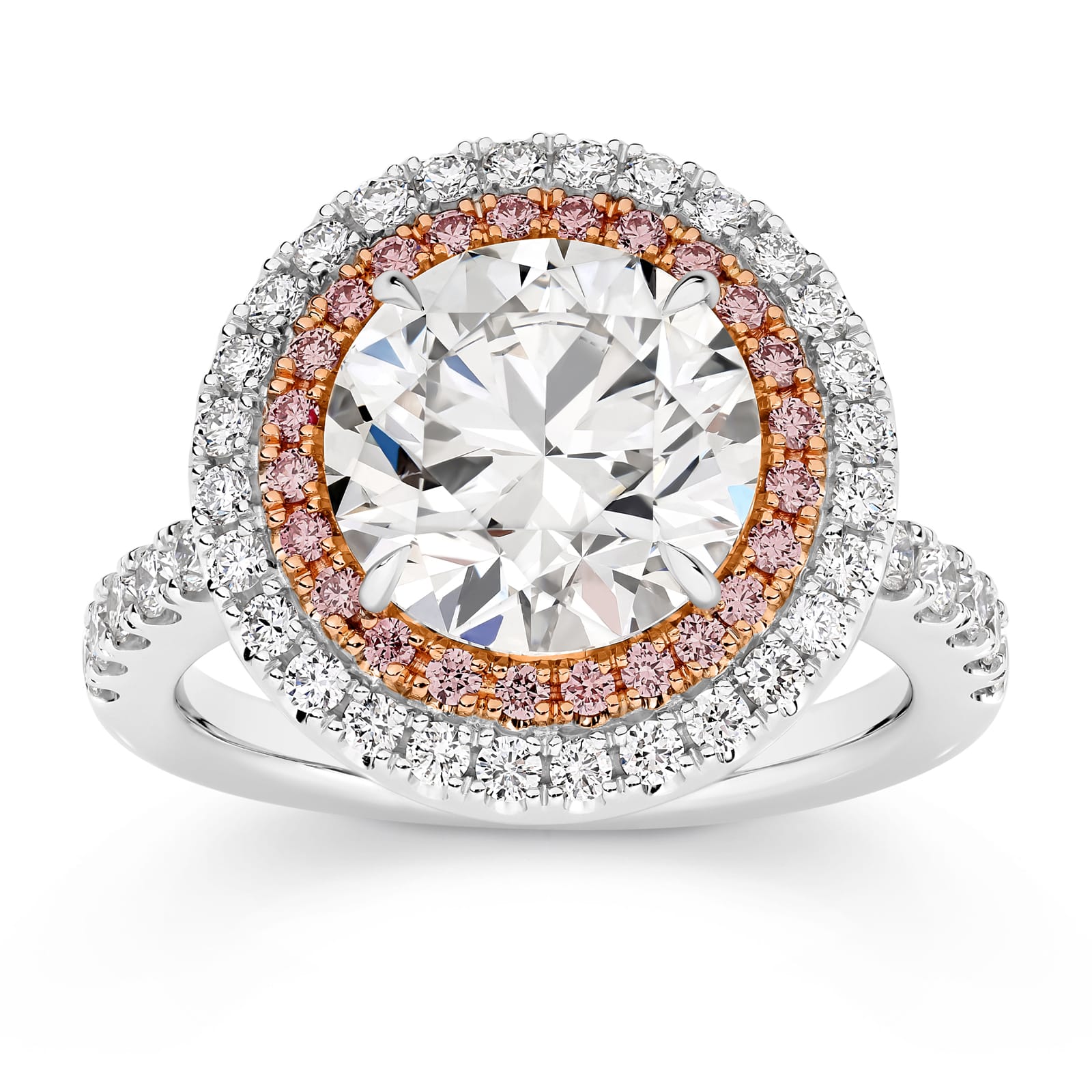 Cleopatra has a stunning 4.51ct round brilliant cut centre diamond surrounded by an inner halo of 24 rare, natural Argyle pink diamonds that, in turn, are showcased by an outer halo of fine white diamonds. She was designed and handcrafted by LeGassick's Master Jewellers, Gold Coast, Australia.