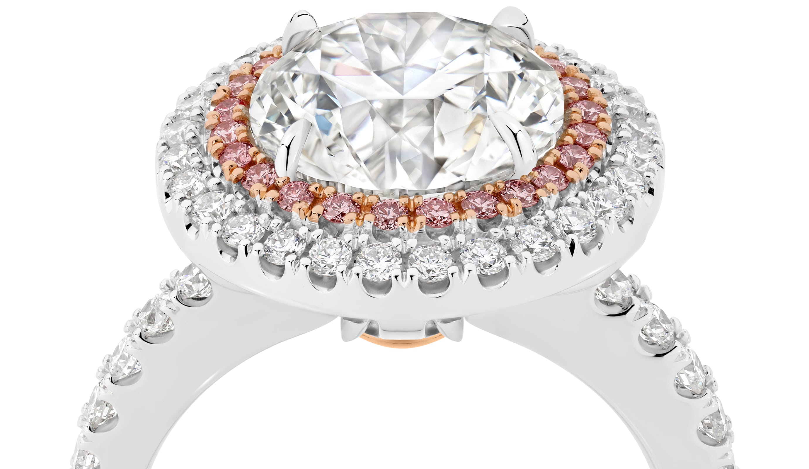 Cleopatra has a stunning 4.51ct round brilliant cut centre diamond surrounded by an inner halo of 24 rare, natural Argyle pink diamonds that, in turn, are showcased by an outer halo of fine white diamonds. She was designed and handcrafted by LeGassick's Master Jewellers, Gold Coast, Australia.