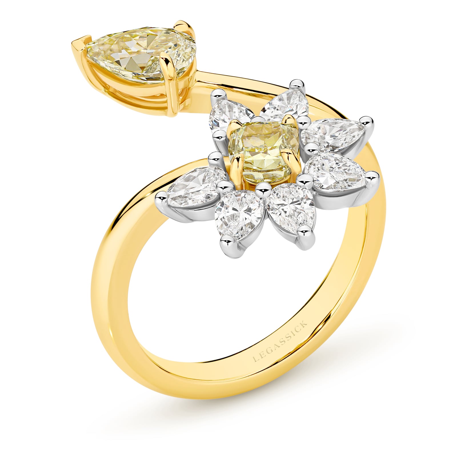 Handcrafted old ring with yellow and clear diamonds on a white background