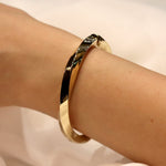 Fancy Twisted Italian Hinged Bangle In 14 Carat Yellow Gold from LeGassick Jewellery, Gold Coast, Australia.