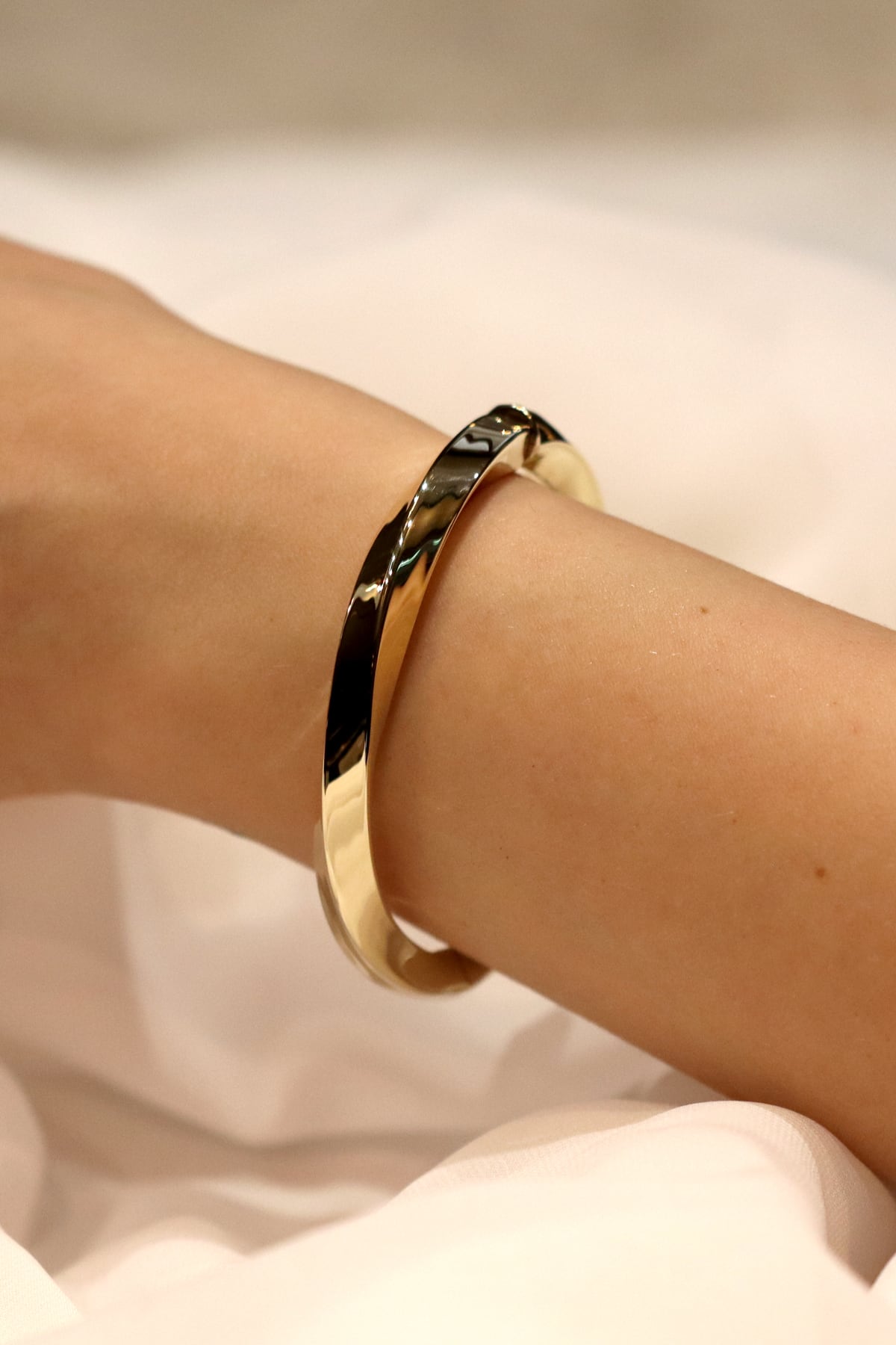 Fancy Twisted Italian Hinged Bangle In 14 Carat Yellow Gold from LeGassick Jewellery, Gold Coast, Australia.