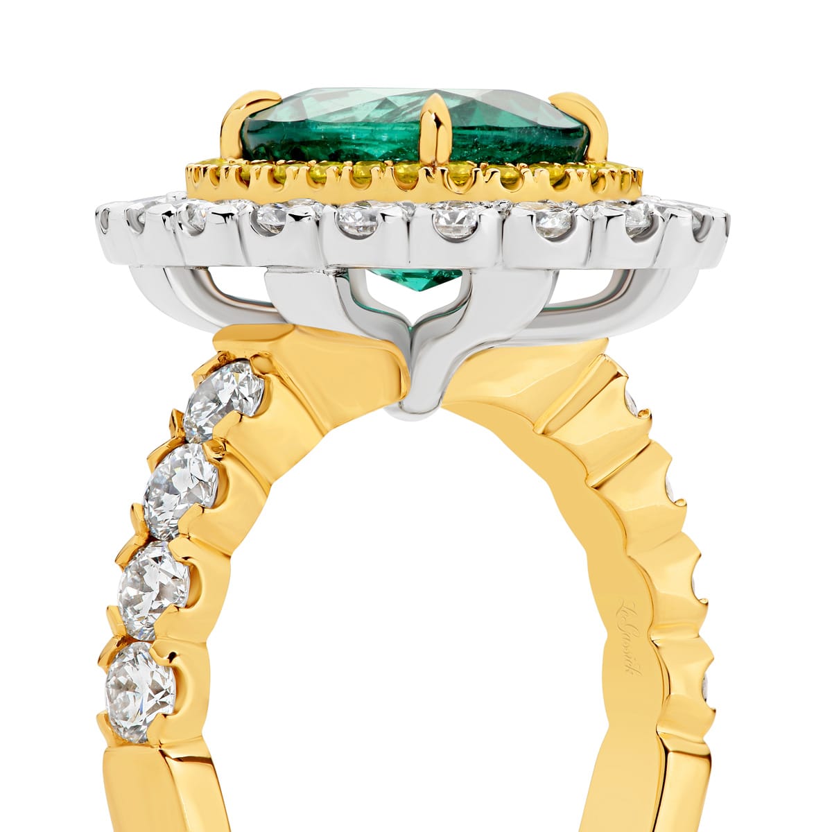 Kai-Mana features natural 3.79 carat oval-cut emerald enhanced by a halo of 28 fancy intense natural yellow diamonds. Surrounded the yellow diamonds in a halo of 20 white round billing cut diamonds. Kai-Mana also features 8 round brilliant cut white diamonds on the band. She was designed and handcrafted by LeGassick's Master Jewellers, Gold Coast, Australia.