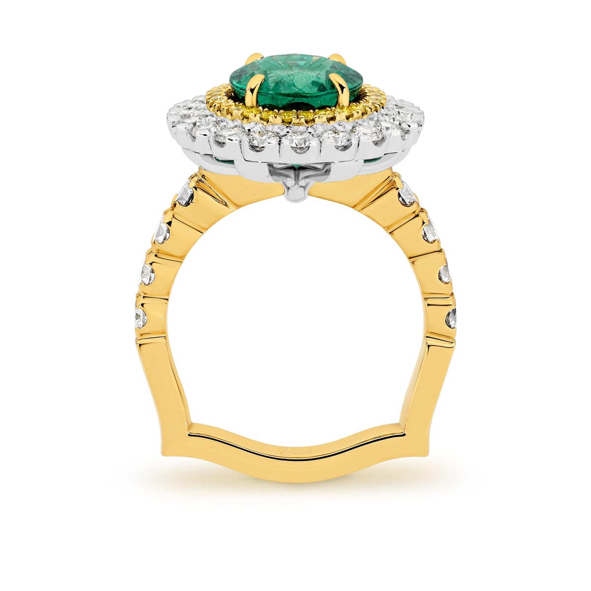 Kai-Mana features natural 3.79 carat oval-cut emerald enhanced by a halo of 28 fancy intense natural yellow diamonds. Surrounded the yellow diamonds in a halo of 20 white round billing cut diamonds. Kai-Mana also features 8 round brilliant cut white diamonds on the band. She was designed and handcrafted by LeGassick's Master Jewellers, Gold Coast, Australia.