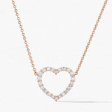 Heart-shaped diamond necklace on a white background