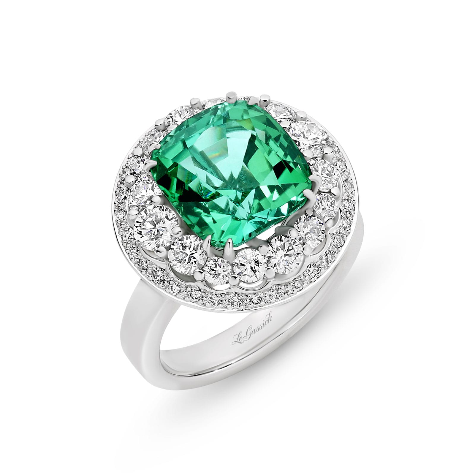 Marihna features a 6.08 carat cushions cut natural green tourmaline poised atop two crowning halos of diamonds. Handcrafted in 18ct white gold with a feature glimpse of yellow gold underneath, her two stunning halos have an enviable total diamond weight of 1.42ct. She was designed and handcrafted by LeGassick's Master Jewellers, Gold Coast, Australia.