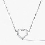 Heart-shaped diamond necklace on a white background