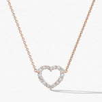 Heart-shaped diamond necklace on a white background