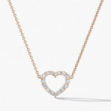 Heart-shaped diamond necklace on a white background