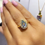 Pear Cut Aquamarine And Diamond Halo Ring available at LeGassick Diamonds and Jewellery Gold Coast, Australia.