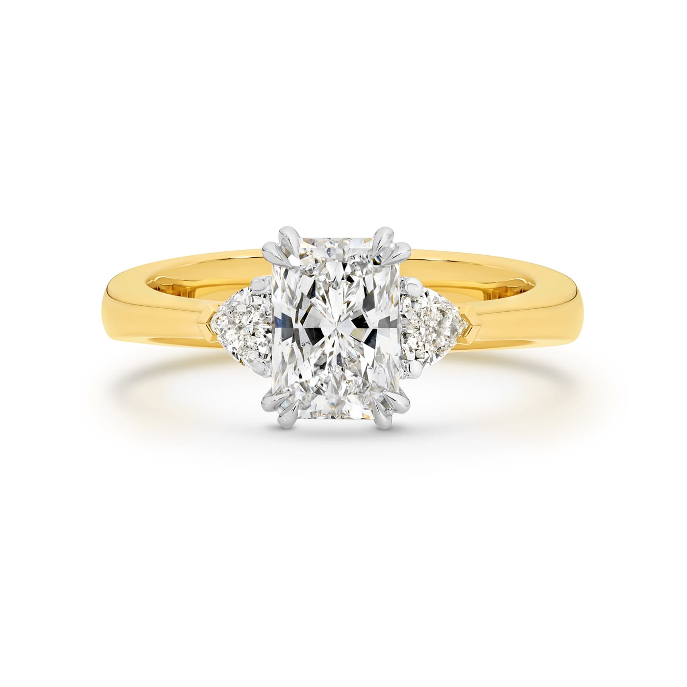 Sierra features a 1.50ct GIA Certified long radiant cut centre diamond, beautifully proportioned on either side with 2 heart shaped diamonds totalling 0.34ct. Handcrafted in 18ct yellow and white gold, she was designed and handcrafted by LeGassick's Master Jewellers, Gold Coast, Australia.