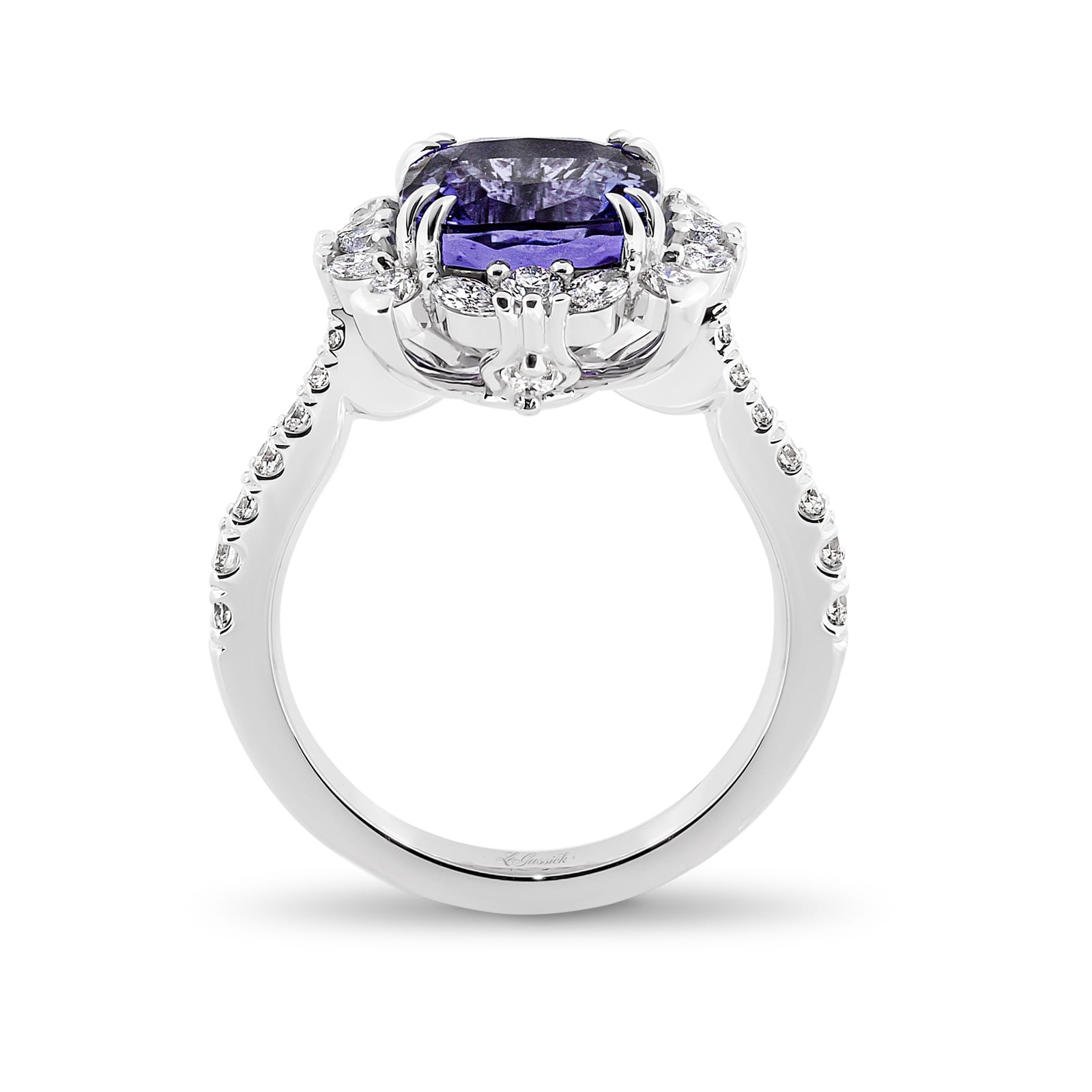 Violetta has a 4.06 carat cushion-cut tanzanite centre surrounded by a halo of alternating white round brilliant cut and marquise cut diamonds. Featuring 2 marquise cut diamonds underneath the ring and 14 round white diamonds on the band. She was designed and handcrafted by LeGassick's Master Jewellers, Gold Coast, Australia.v