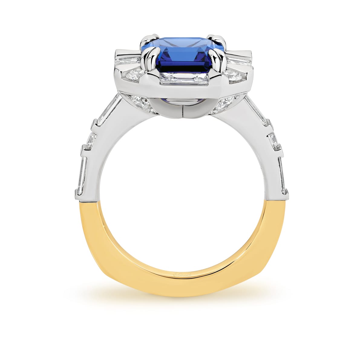 Zarriah features a 3.17ct Asscher cut tanzanite surrounded by a halo of baguette and round brilliant cut diamonds. Her centre stone is set in a double corner claws and her shoulders feature baguettes and round brilliant cut diamonds. Handcrafted to perfection in 18 carat yellow and white gold, she was designed and handcrafted by LeGassick's Master Jewellers, Gold Coast, Australia.