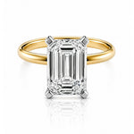 Gold ring with a lab diamond on a white background