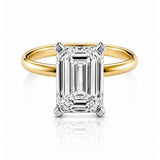 Gold ring with a lab diamond on a white background