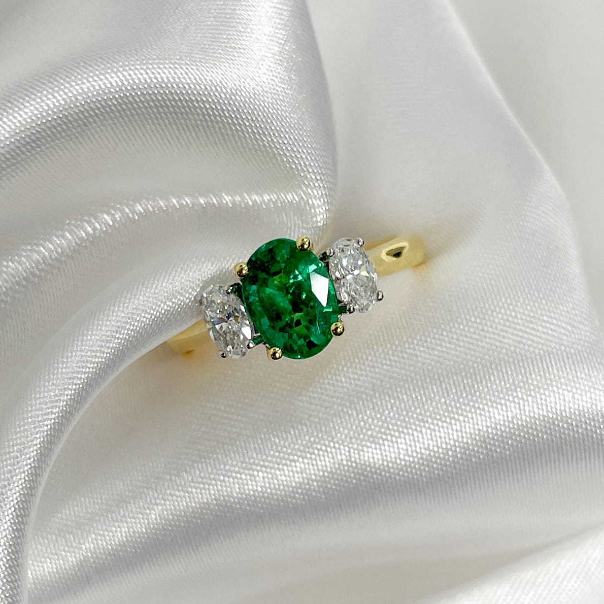 Emerald and diamond ring with yellow gold band available at LeGassick Diamonds and Jewellery Gold Coast, Australia.