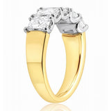 5 Stone gold and lab diamond ring on a white background
