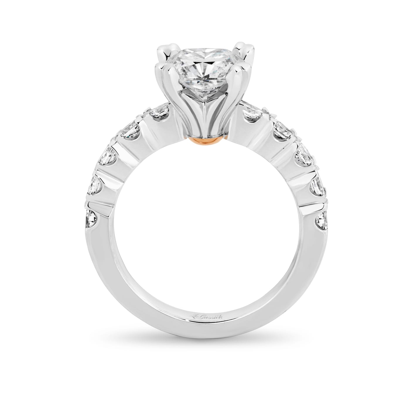 Grace has a 2.04 carat cushion-cut solitaire featuring 10 white oval cut diamonds on the band. Grace also features a natural Argyle pink diamond that has been nestled under her setting. She was designed and handcrafted by LeGassick's Master Jewellers, Gold Coast, Australia.