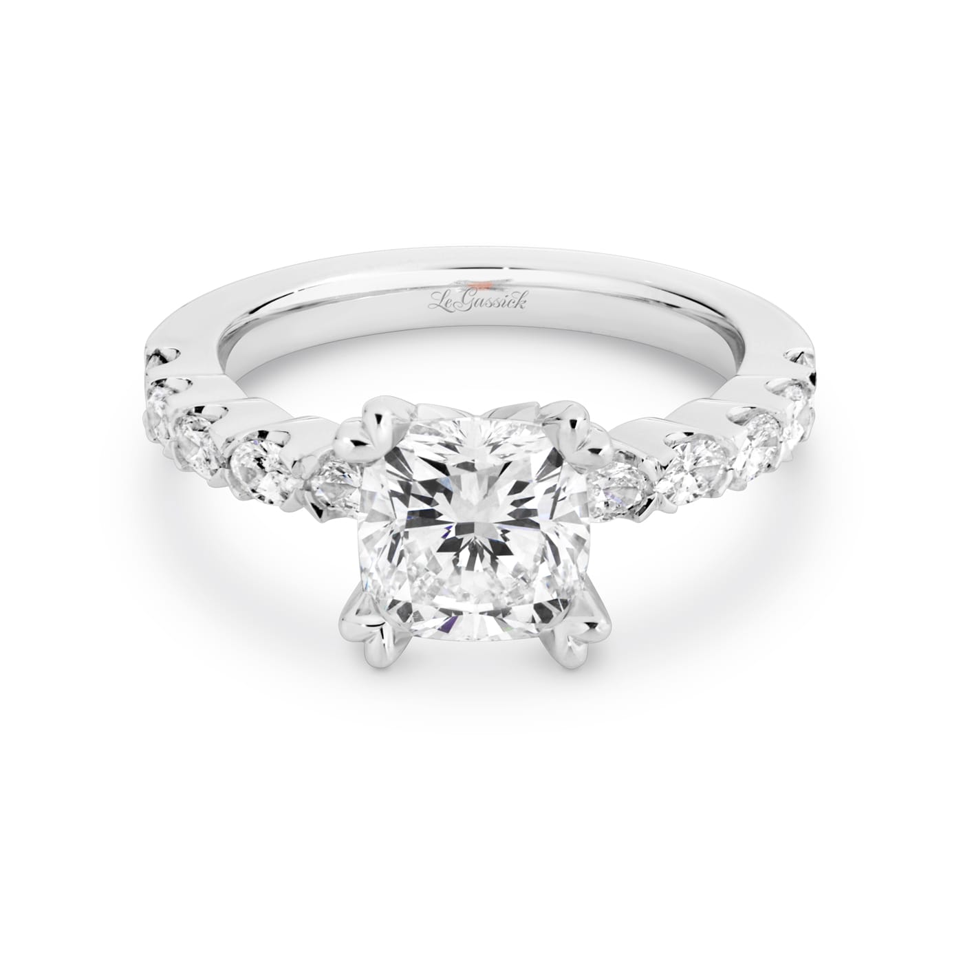 Grace has a 2.04 carat cushion-cut solitaire featuring 10 white oval cut diamonds on the band. Grace also features a natural Argyle pink diamond that has been nestled under her setting. She was designed and handcrafted by LeGassick's Master Jewellers, Gold Coast, Australia.