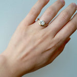 Lady wearing the Kirsten... 1.0 Carat Oval Cut Lab Diamond Bezel Set Ring from The Madison Collection on a white background
