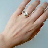 Lady wearing the Kirsten... 1.0 Carat Oval Cut Lab Diamond Bezel Set Ring from The Madison Collection on a white background