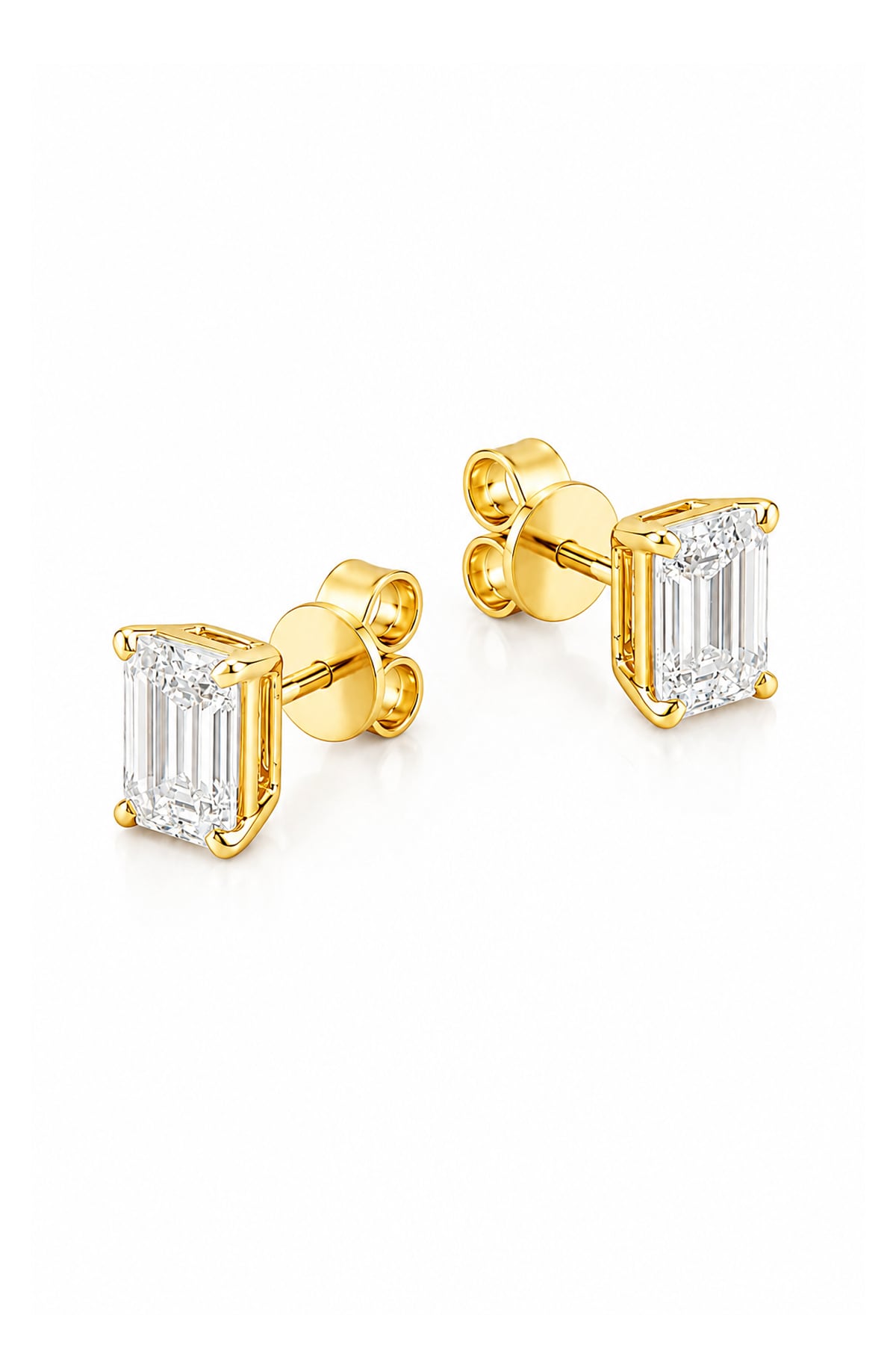 A pair of yellow gold stud earrings featuring rectangular emerald-cut clear diamonds in four-prong settings, shown on a clean white background.