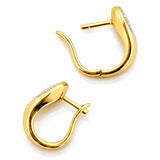 A pair of gold huggie hoop earrings with pear-cut diamond inlays, shown on a clean white background with a soft reflection.