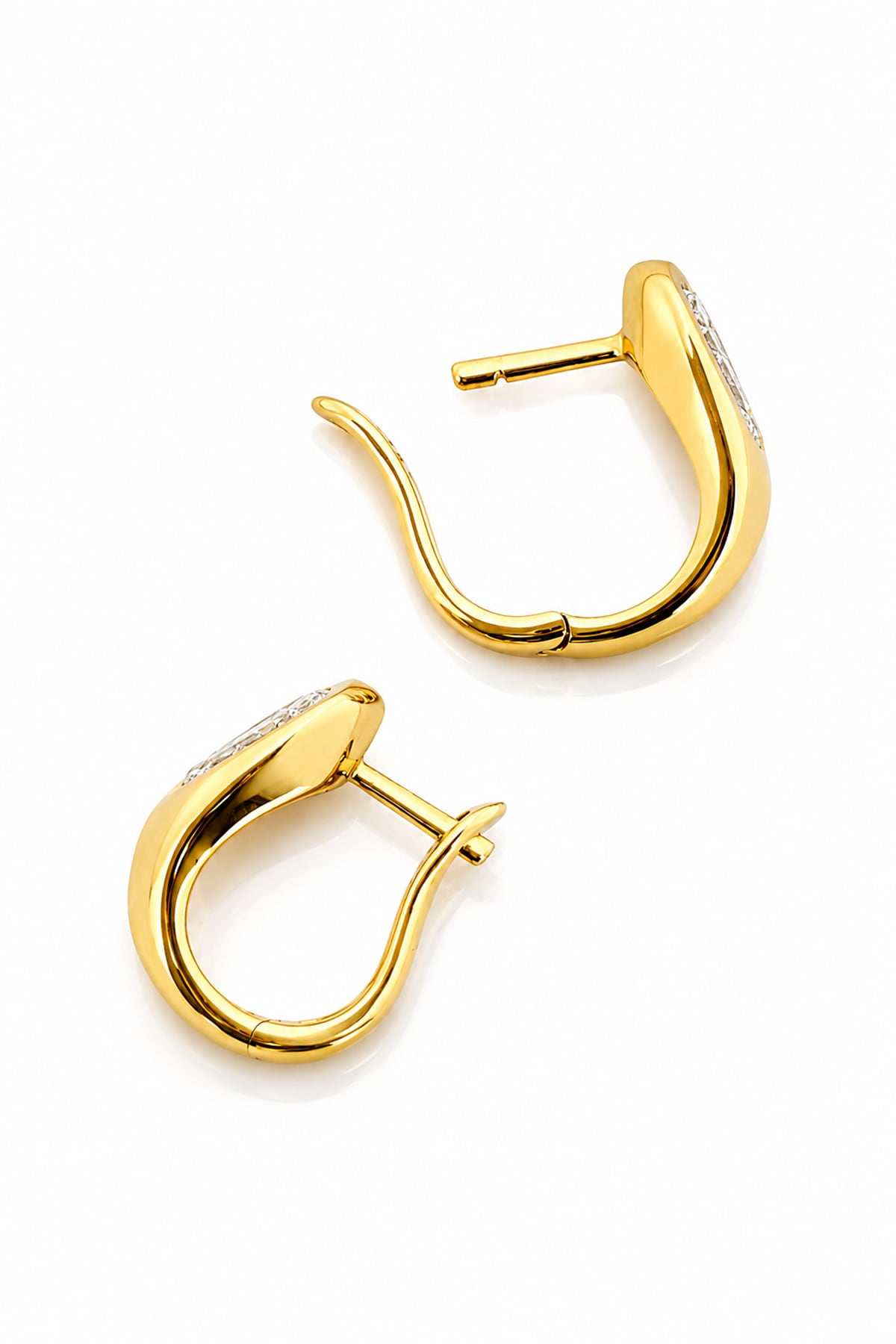 A pair of gold huggie hoop earrings with pear-cut diamond inlays, shown on a clean white background with a soft reflection.