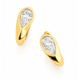 A pair of gold huggie hoop earrings with pear-cut diamond inlays, shown on a clean white background with a soft reflection.