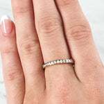 Lady wearing a Claw Set Diamond Band In 18ct Yellow Gold